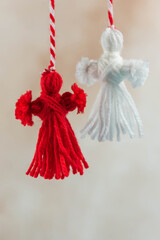 Traditional Martisor - symbol of holiday 1 March, Martenitsa, Baba Marta, beginning of spring and seasons changing in Romania, Bulgaria, Moldova. Greeting and post card for holidays.