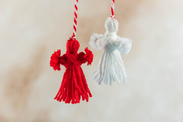 Traditional Martisor - symbol of holiday 1 March, Martenitsa, Baba Marta, beginning of spring and seasons changing in Romania, Bulgaria, Moldova. Greeting and post card for holidays.