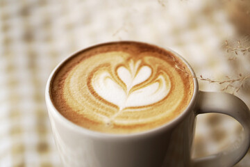 cup of coffee on wooden table