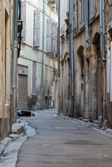 Nimes, Occitanie, France - Facades of a narrow street in old town