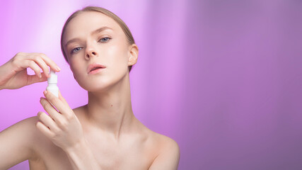 Beauty and skin care. Happy woman with fresh radiant, hydrated skin standing with bare shoulders...