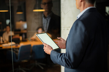 Close up of man using digital tablet..