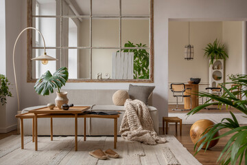 Open space interior with modular sofa, wooden coffee table, big window, beige rug, braided plaid,...