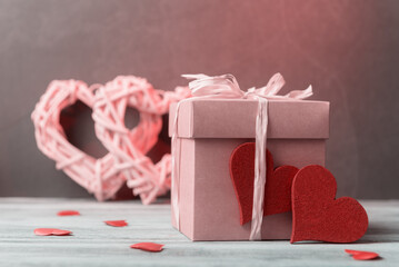 Valentine’s day concept with gift box and decorative hearts