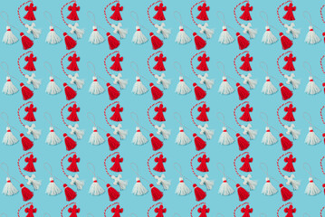 Traditional Martisor - symbol of holiday 1 March, Martenitsa, Baba Marta, beginning of spring and seasons changing in Romania, Bulgaria, Moldova. Greeting and post card for holidays. Blue background.