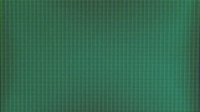 Macro view of a television LED screen with RGB sub-pixels. Colored pixels in close-up create an abstract pattern. Red, blue, and green LCD pixels background of VA matrix of 4K TV. Closeup monitor.