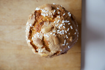 Traditional italian Panettone, typical Christmas cake, on a chopping board. Top view.