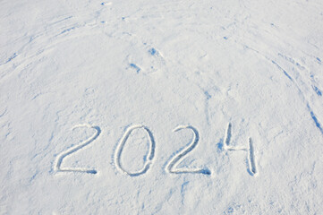 new year 2024. figures in the snow. background for winter holidays.