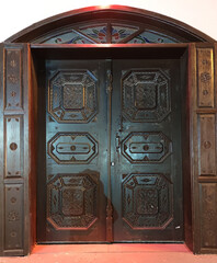 antique wooden carved brown double door close-up