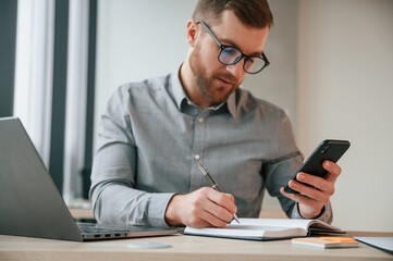 Businessman in formal clothes is working in the office