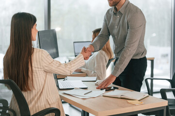 Man and woman is working together. Successful team are in the office. Conception of business