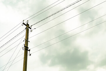Power electric pole with line wire on colored background close up