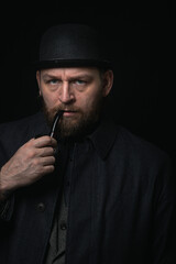 stylish man in retro outfit suit hat smoking wooden pipe sherlock holmes look cosplay england gentleman fashionable confident gangster Guy Ritchie Charlie Hunnam style