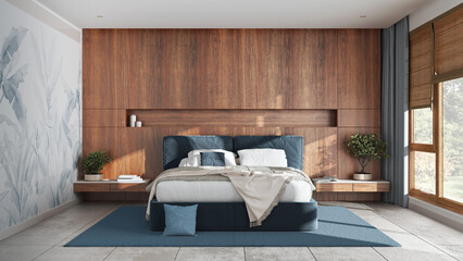 Modern bedroom with wooden headboard in white and blue tones. Velvet bed, bedding, pillows and...