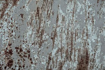 Rusty metal plate; texture of abrasion, erosion and destruction; old paint