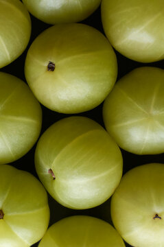close-up view of fresh amla or indian gooseberry, pile of emblic high vitamin c contain fruit in full frame, fruit background