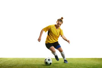 Dribbling. Concentrated young professional female football player in motion, playing football, soccer isolated over white background