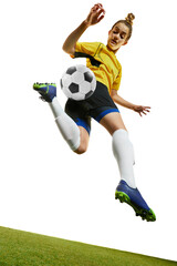 Young woman, professional female football, soccer player in motion, training, playing isolated over white background. Dynamic game