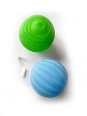 Squeaky balls with the squeak removed - a dangerous choking hazard for small children who chew their toys. 