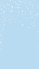 Fototapeta premium Beautiful snowfall christmas background. Subtle flying snow flakes and stars on light blue winter backdrop. Beautiful snowfall overlay template. Vertical vector illustration.