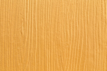 Naklejka premium Yellow color with an old wooden wall texture as a background.