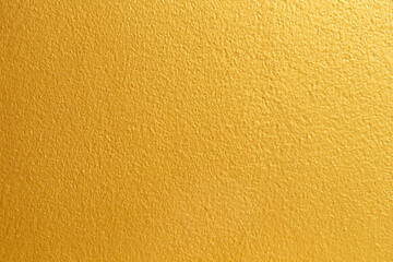 Golden color with an old grunge wall concrete texture as a background.