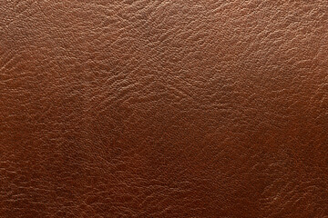 Brown leather and a textured background.