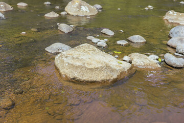 Rocks in water in small a river