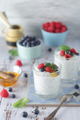 Greek yogurt in glasses with berries and quinoa	