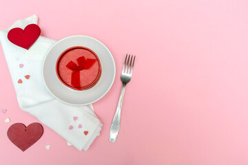 Valentines Day and Womens Day concept, table setting with gift box on plate, hearts, fork top