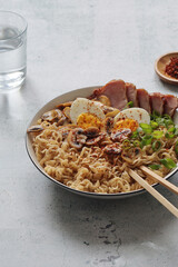A bowl with ramen, an Asian noodle soup