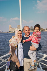 happy family enjoying the sun and the Nile in boat trip, Cairo, Egypt. family spend the holiday with nature.