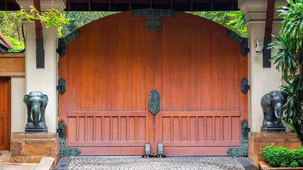large entrance gate with elephants on either side