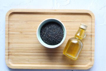 Black Cumin seeds oil on table top view 