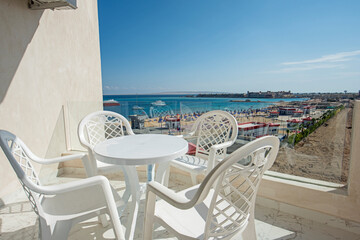 Terrace balcony with chairs in tropical luxury apartment resort
