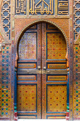 Colorful beautiful wooden door in Arabic style, Fez, Morocco, Africa