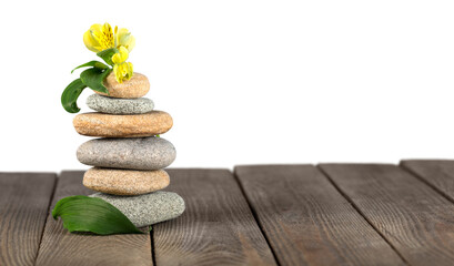 Stack of stones on a wooden desk, zen stone concept