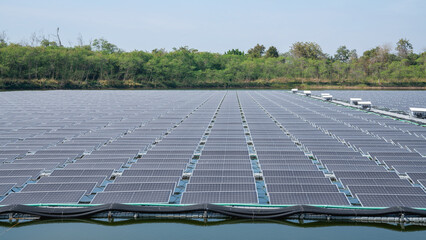 Solar power plant farm on beautifull lake. Floating solar panels providing green energy. Renewable energy.