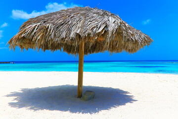 Palapa in secluded beach and turquoise caribbean sea, Aurba, Antilles