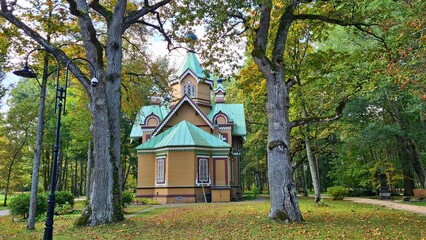 Small Orthodox church among the trees in the Latvian city of Jurmala in autumn 2022