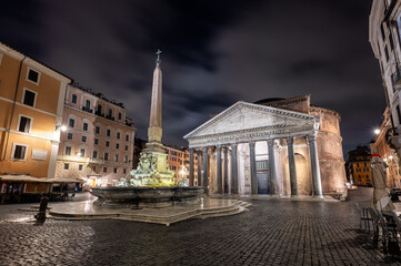 Fototapeta na wymiar The empty Rotonda Square (Piazza della Rotonda) and illuminated ancient Pantheon in Rome in dark hours before sunrise, Italy