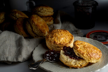 Freshly baked scones with cranberry-cherry preserves