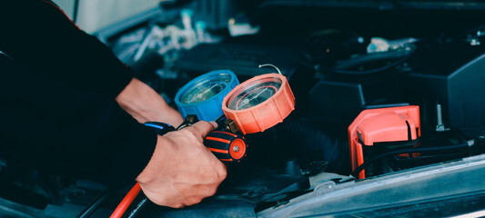 car service worker repairing vehicle , For customers who use cars for repair services .