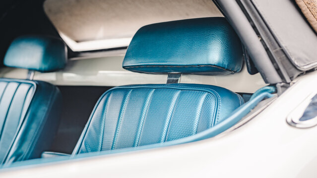 Blue front seat of a classic American sportscar