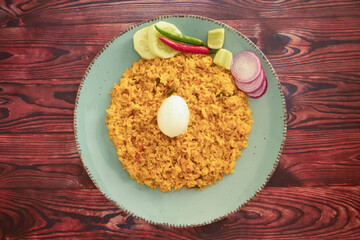 spicy Egg pulao, polao, biryani, mandi, kacchi with egg and salad served in dish isolated on table top view of indian food