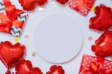 Podium or pedestal and gift boxes with red heart shape balloons on white background. Valentines Day...