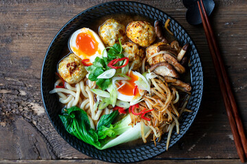 Ramen soup with meatballs and udon noodles