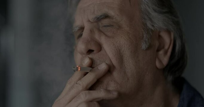 Old man smoking a cigarette
