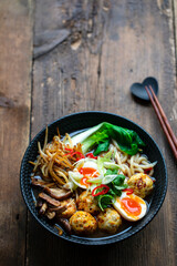 Ramen soup with meatballs and udon noodles