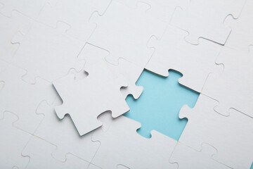 The last piece of jigsaw puzzle to complete the mission on blue background